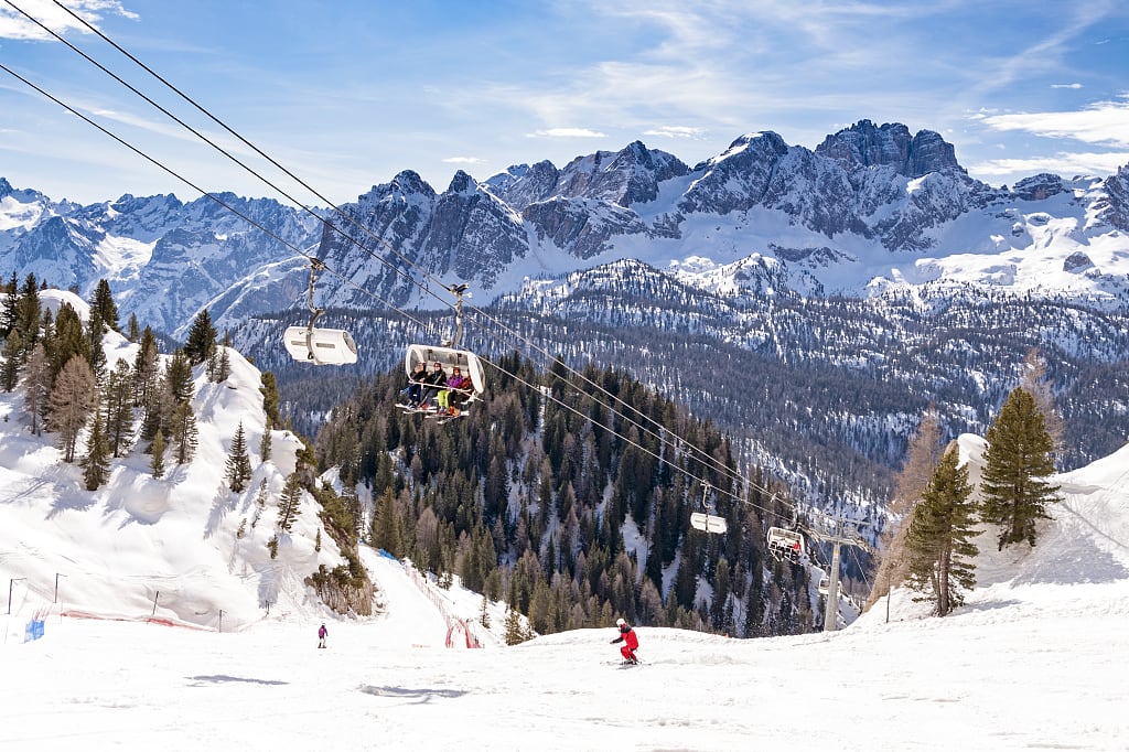 Downhill skiing at the Cortina d'Ampezzo ski resort in the Dolomites. Downhill skiing at the Cortina d'Ampezzo ski resort in the Dolomites.