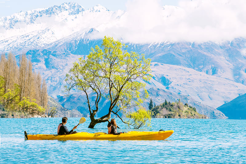 Couple kayaking Lake Wanaka in New Zealand