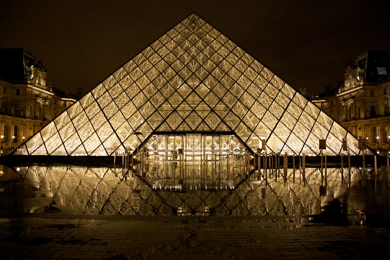Illuminated entrance to the Louvre in Paris.