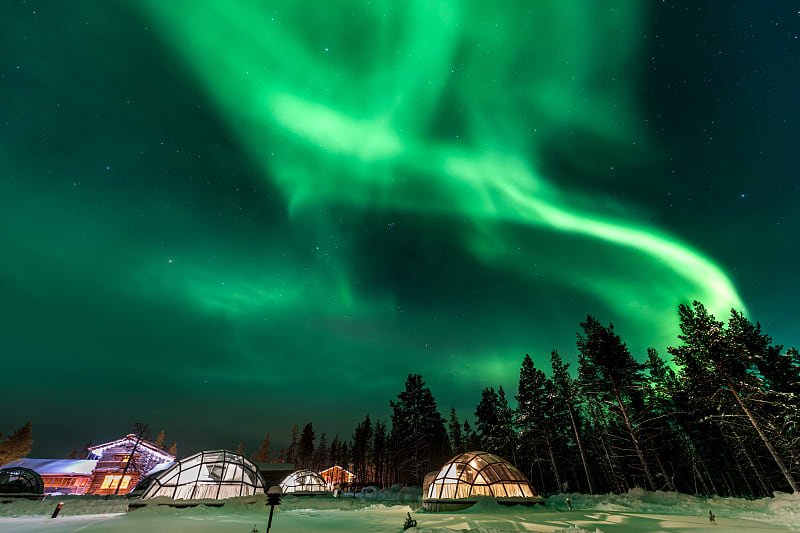 Aurora Borealis above igloos in Finland Aurora Borealis above igloos in Finland