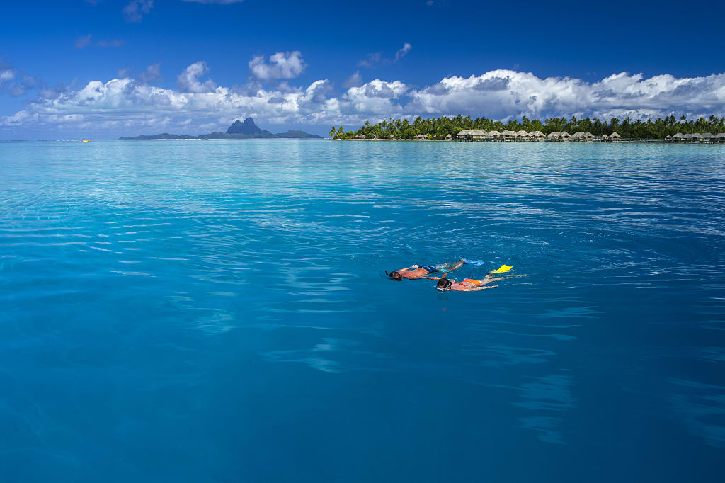 Couple snorkeling in Tahaa, Tahiti. Photo by David Kirkland, courtesy of Tahiti Tourisme Couple snorkeling in Tahaa, Tahiti. Photo by David Kirkland, courtesy of Tahiti Tourisme