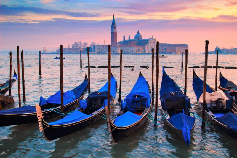 blue gondolas on water in venice