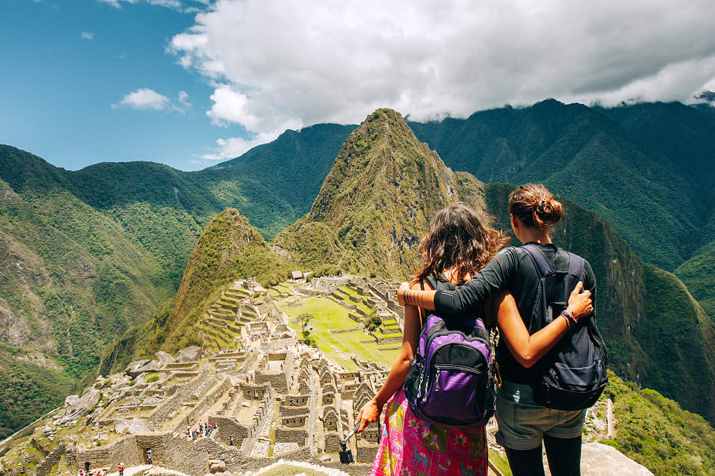 Couple visiting Machu Picchu, Peru Couple visiting Machu Picchu, Peru