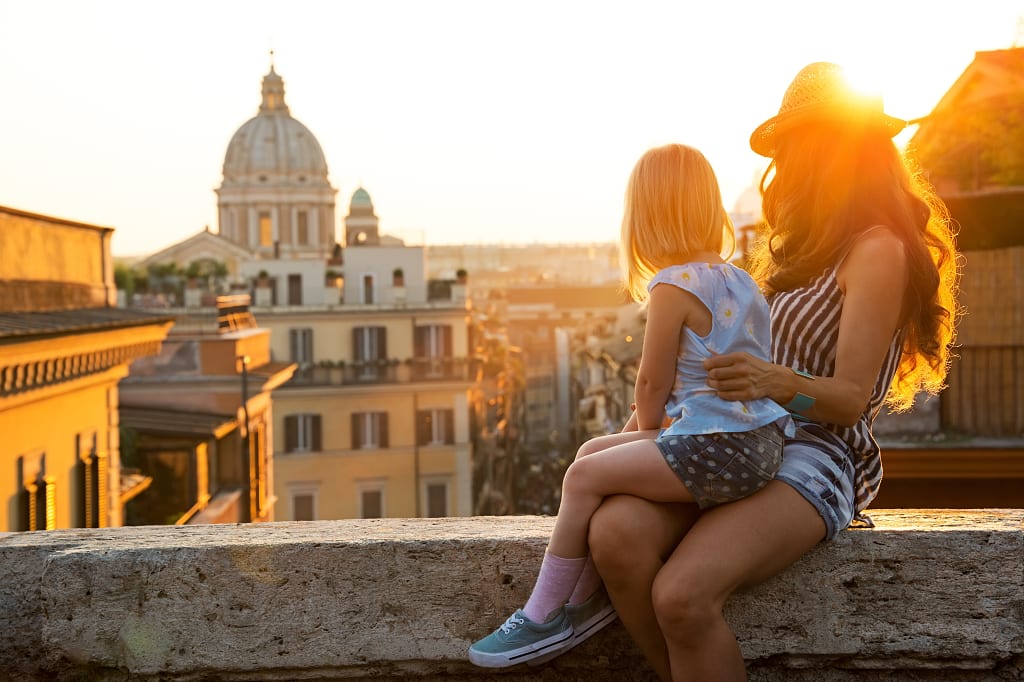 A mother and daughter overlooking the rooftops of Rome. A mother and daughter overlooking the rooftops of Rome.