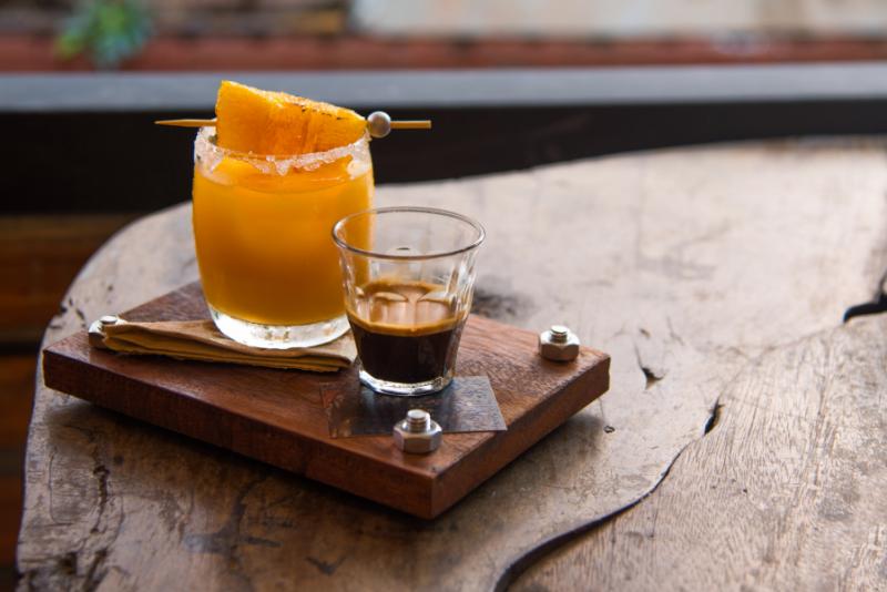 A cup of rich Colombian coffee and fresh orange juice.