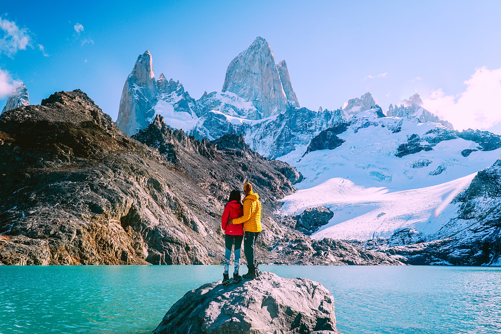 Couple enjoying the view at Mount Fitzroy in Patagonia, Argentina Couple enjoying the view at Mount Fitzroy in Patagonia, Argentina